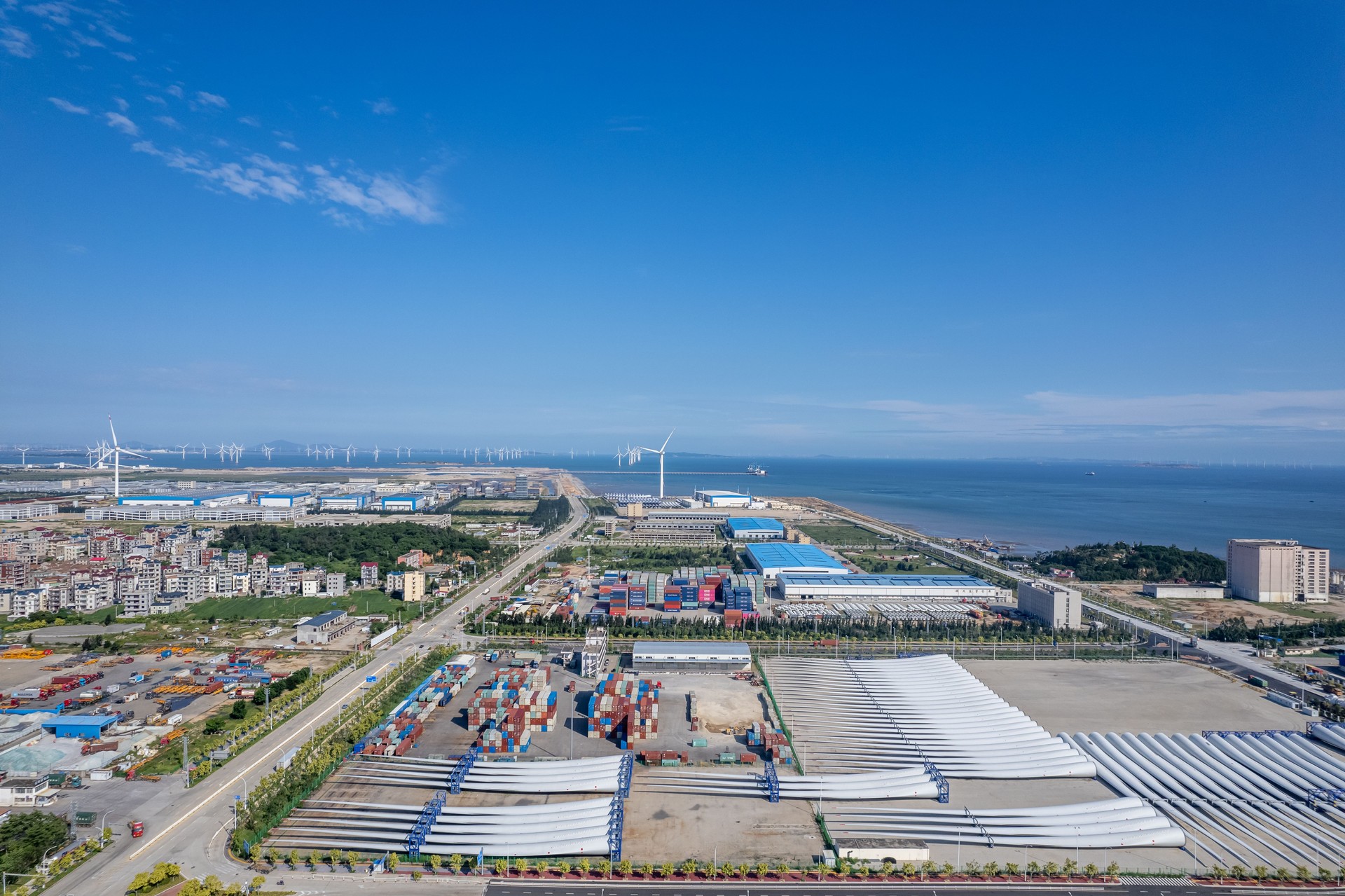 Aerial view of uninstalled wind turbine propeller blades and wind power on the seaside
